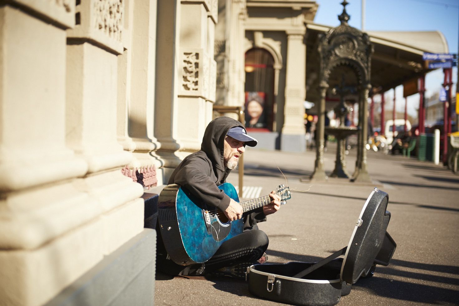 Homeless person busking